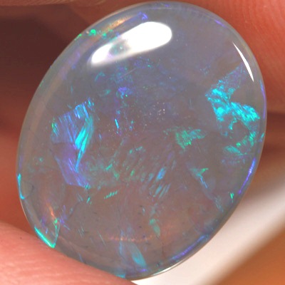 SOLID CRYSTAL OPAL Large opal 9cts! Peacock fire in alarge rolling flashes. Bright, clean colours. With VIDEO